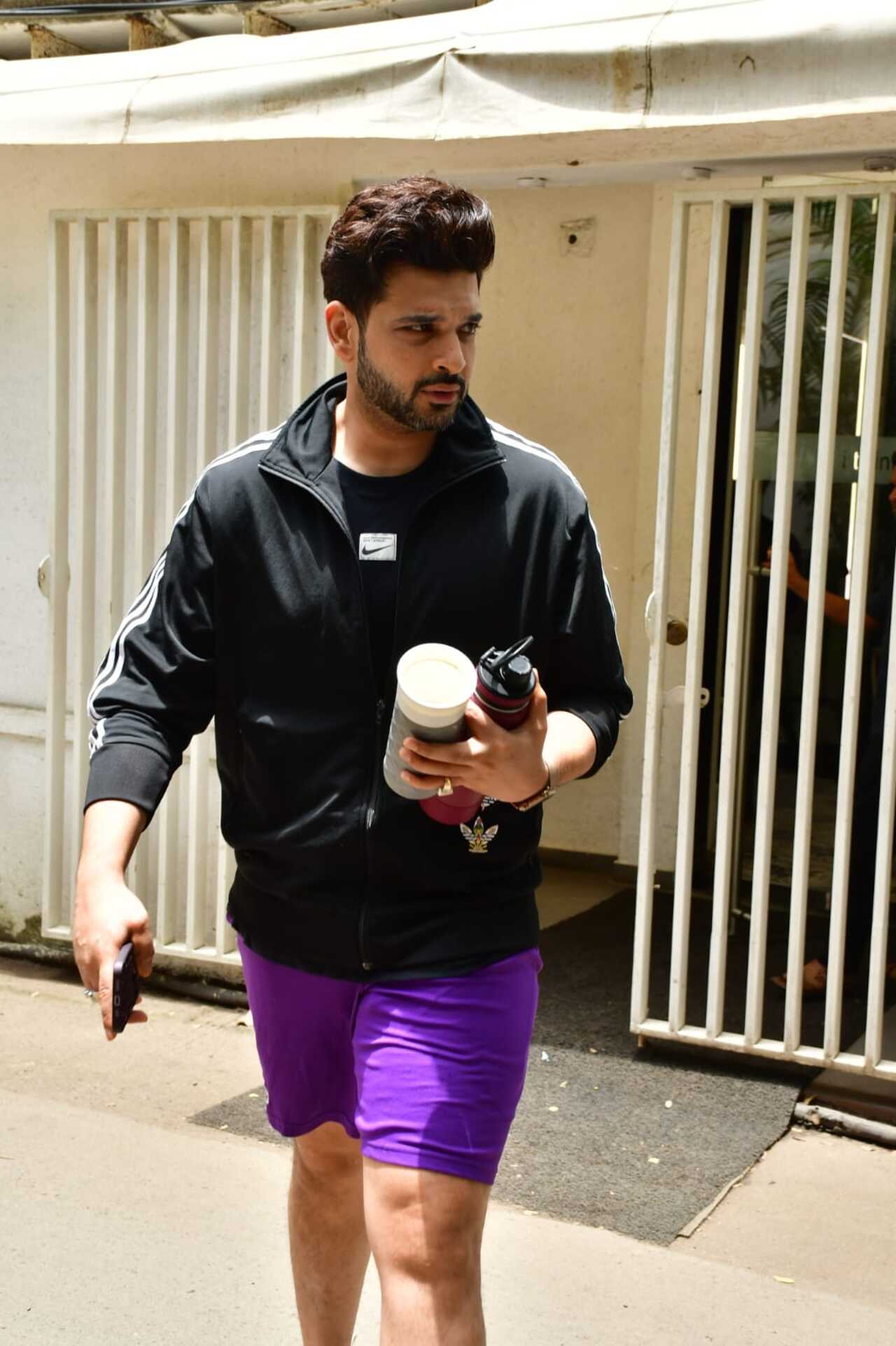 He was seen in purple shorts and a black tee